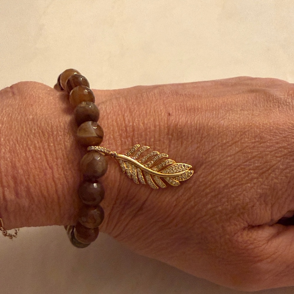 Tiger eye stretch bracelet with gold pave feather charm